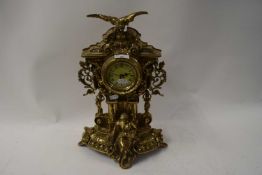 20TH CENTURY ORNATE BRASS CASED MANTEL CLOCK WITH QUARTZ MOVEMENT