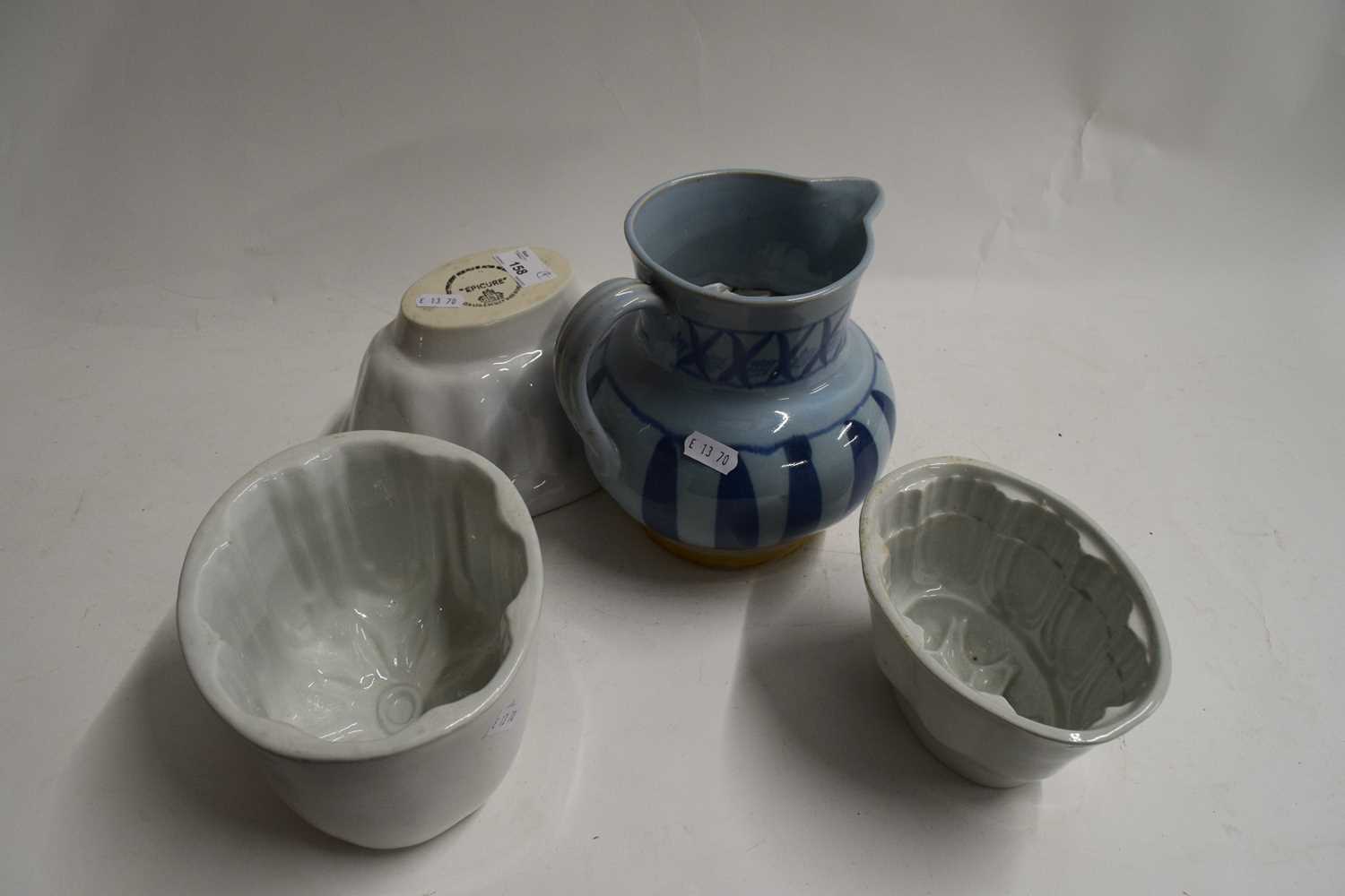 MIXED LOT : THREE JELLY MOULDS AND A BUCHAN POTTERY JUG (4)