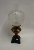 BRASS AND CAST IRON BASED OIL LAMP WITH OPAQUE GLASS SHADE