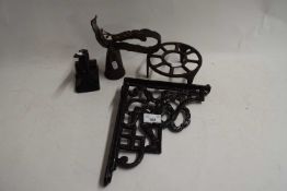 MIXED LOT : CAST IRON WALL BRACKET, DESK STAMPER, COW BELL AND A TRIVET (4)