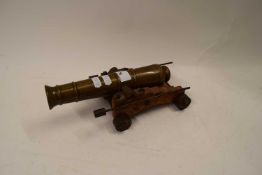 SMALL BRASS TABLE CANNON ON OAK STAND