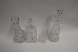 THREE VARIOUS CLEAR GLASS DECANTERS AND THREE THISTLE LIQUEUR GLASSES