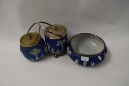 TWO BLUE JASPERWARE BISCUIT BARRELS AND A FURTHER SIMILAR SALAD BOWL