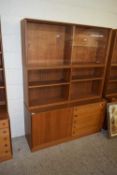 MID-CENTURY TEAK TWO-SECTION CABINET WITH SHELF TO TOP AND THE BASE WITH FIVE DRAWERS AND ONE