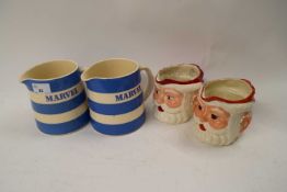 TWO T G GREEN CORNISH WARE JUGS MARKED 'MARBLE', TOGETHER WITH TWO FURTHER SANTA CLAUS JUGS (4)