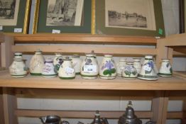 COLLECTION OF SMALL DEVONWARE VIOLET VASES