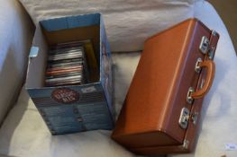 BOX OF CDS AND A SMALL SUITCASE