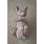 Garden ornament modelled as a fox, length approx 40cm
