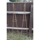 Pair of traditional open framed metal obelisks, 130cm high