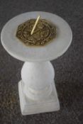 Composite formed plinth with a brass sundial, height approx 45cm