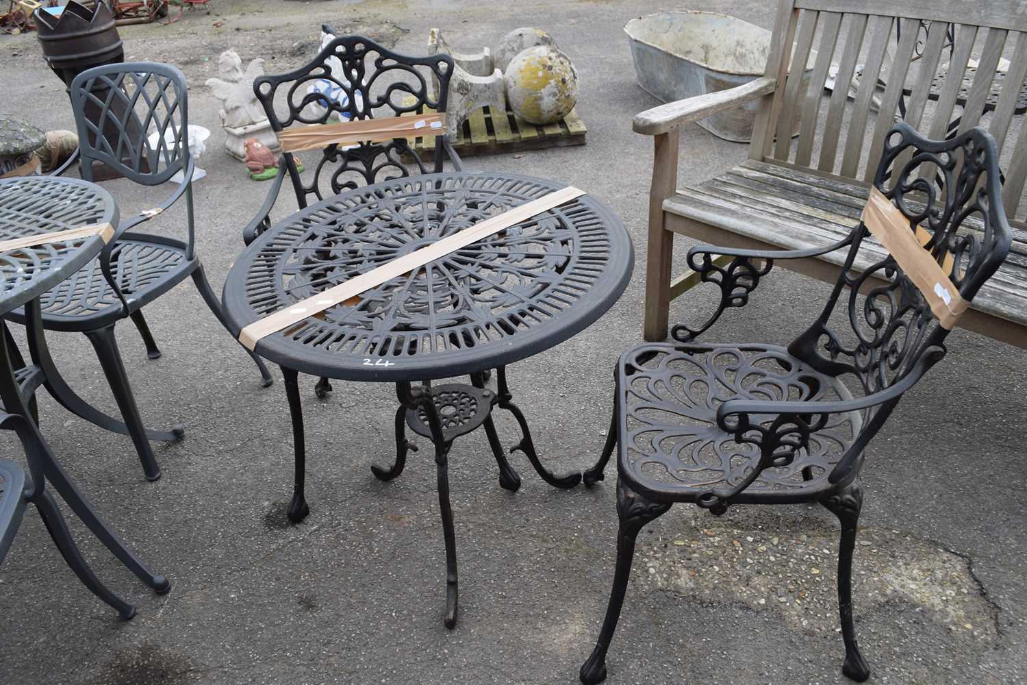 Cast bistro set to include table and two chairs