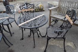Cast bistro set to include table and two chairs