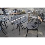 Cast bistro set to include table and two chairs