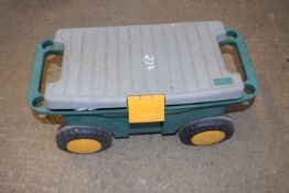Portable garden trolley with hose attachment etc
