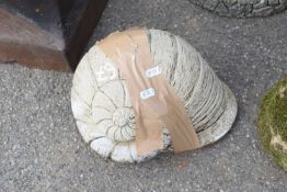 Composite garden ornament in the shape of a shell