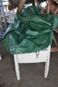 Set of four plastic garden chairs with cover