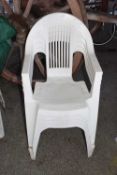 Set of four plastic garden chairs