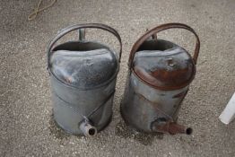 Two galvanised watering cans