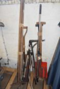 Large quantity of garden clearance tools to include rakes, forks, saws, pruners etc