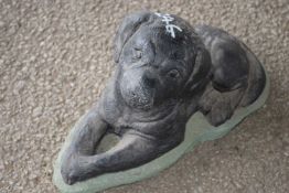 Composite garden ornament in the shape of a dog, length approx 40cm