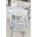 Cast metal bistro garden set comprising a table and two chairs