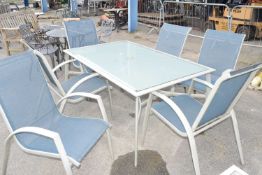 Large metal and glass garden table with six chairs and two side tables
