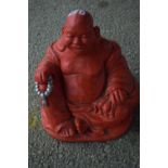 Red composite model of a Buddha, height approx 30cm