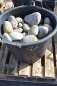 Bucket of white decorative stones