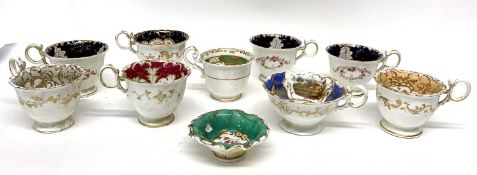 Quantity of 19th century English porcelain cups with various floral designs, together with small