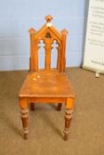 Victorian ecclesiastical style oak hall chair with pierced arched back, 90cm high