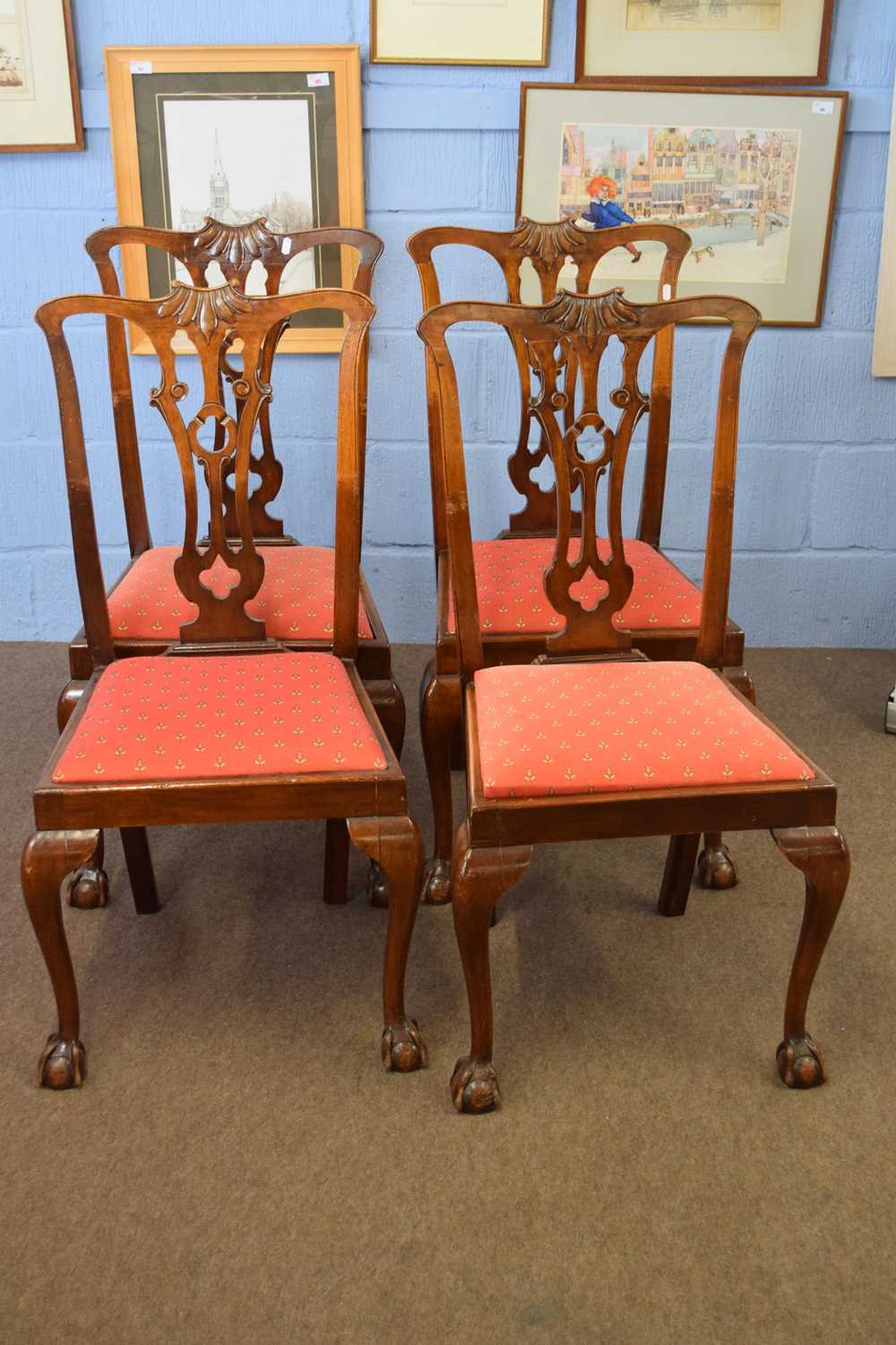 Set of four early 20th century mahogany framed dining chairs with pierced splat backs and ball and