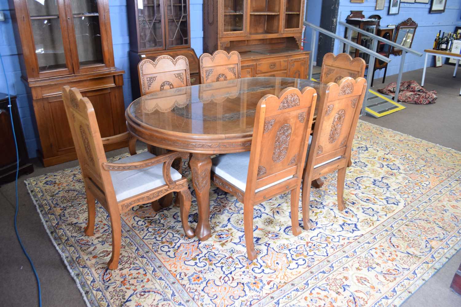 Kashmiri hardwood and floral carved dining room suite comprising an oval table with inset glass - Image 2 of 5