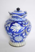 Deco vase and cover, the blue ground with floral decoration, the base marked 'Melba'