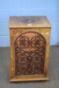 Victorian walnut veneered single door side cabinet, the door set with a floral fretwork panel,