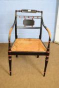 Regency armchair with ebonised red painted frame and a cane seat, 85cm high