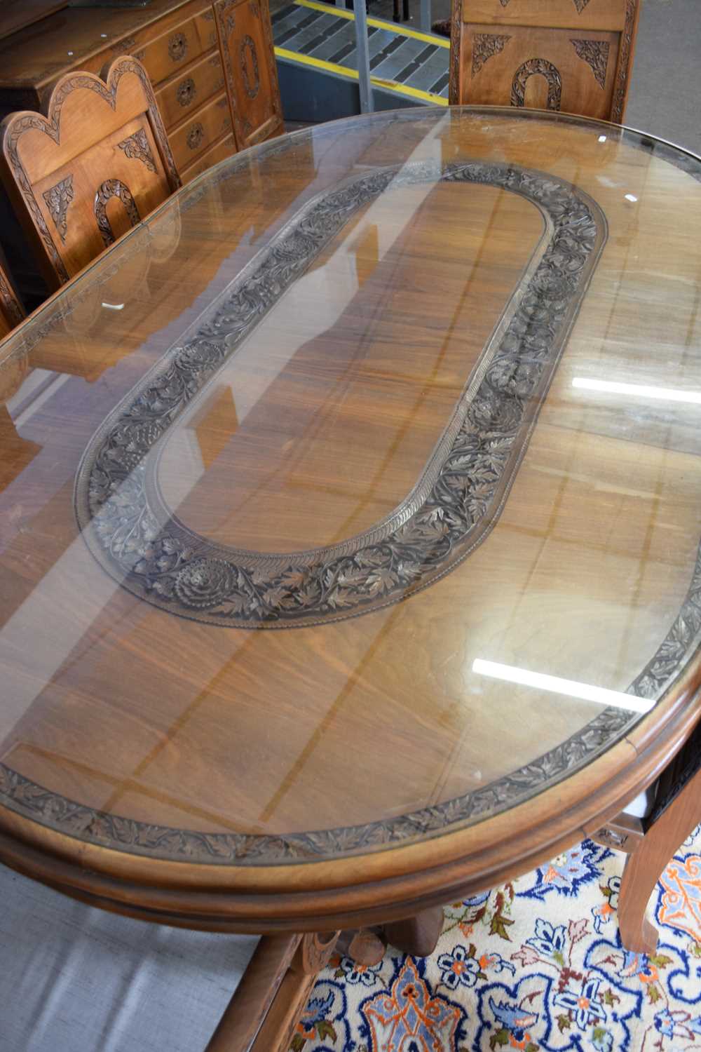 Kashmiri hardwood and floral carved dining room suite comprising an oval table with inset glass - Image 3 of 5