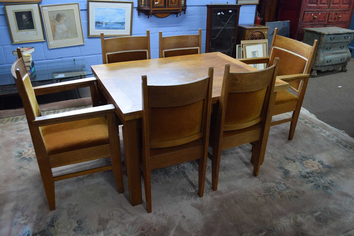 An unusual early 20th century set of six oak framed dining chairs with push-out upholstered seats