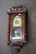 Late 19th century Vienna wall clock set in an architectural case with pillared side supports,