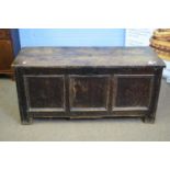 18th century oak coffer with board top over three panelled front raised on short stile feet, 134cm