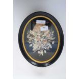 Shell model of a basket of flowers in black wooden frame, label verso for Mai Williams