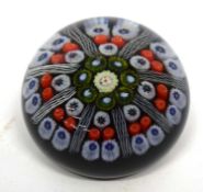 Paperweight with a series of multi-coloured canes within latticino borders