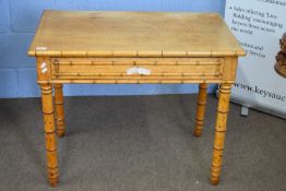 19th century faux bamboo and maple veneered table with single drawer and turned legs, 90cm wide