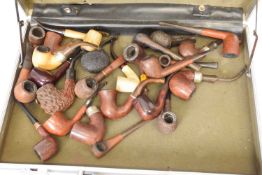 Suitcase containing a quantity of smoking pipes including a peterson's system, ORLIK hurricane,