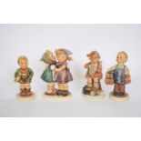 Group of four Goebel figures of children, designed by Hummel, including Boots and others (4)