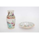 Small Chinese porcelain vase with a polychrome design and small Chinese porcelain saucer (2)