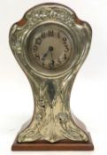 Early 20th century mantel clock, the hardwood case with silver plated floral mounts, 29cm high