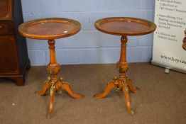 Pair of 20th century Continental Empire style brass mounted wine tables with circular tops over
