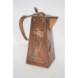 Newlyn School copper jug with wicker handle