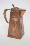 Newlyn School copper jug with wicker handle