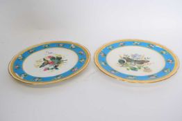 Pair of Minton plates with designs of butterflies and flowers within turquoise borders, decorated